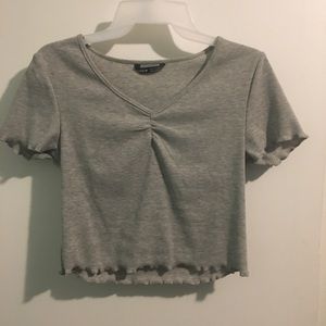 Lettuce trim ruched front rib knit top